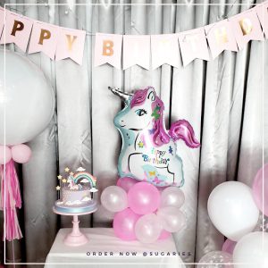 pony cake and balloon